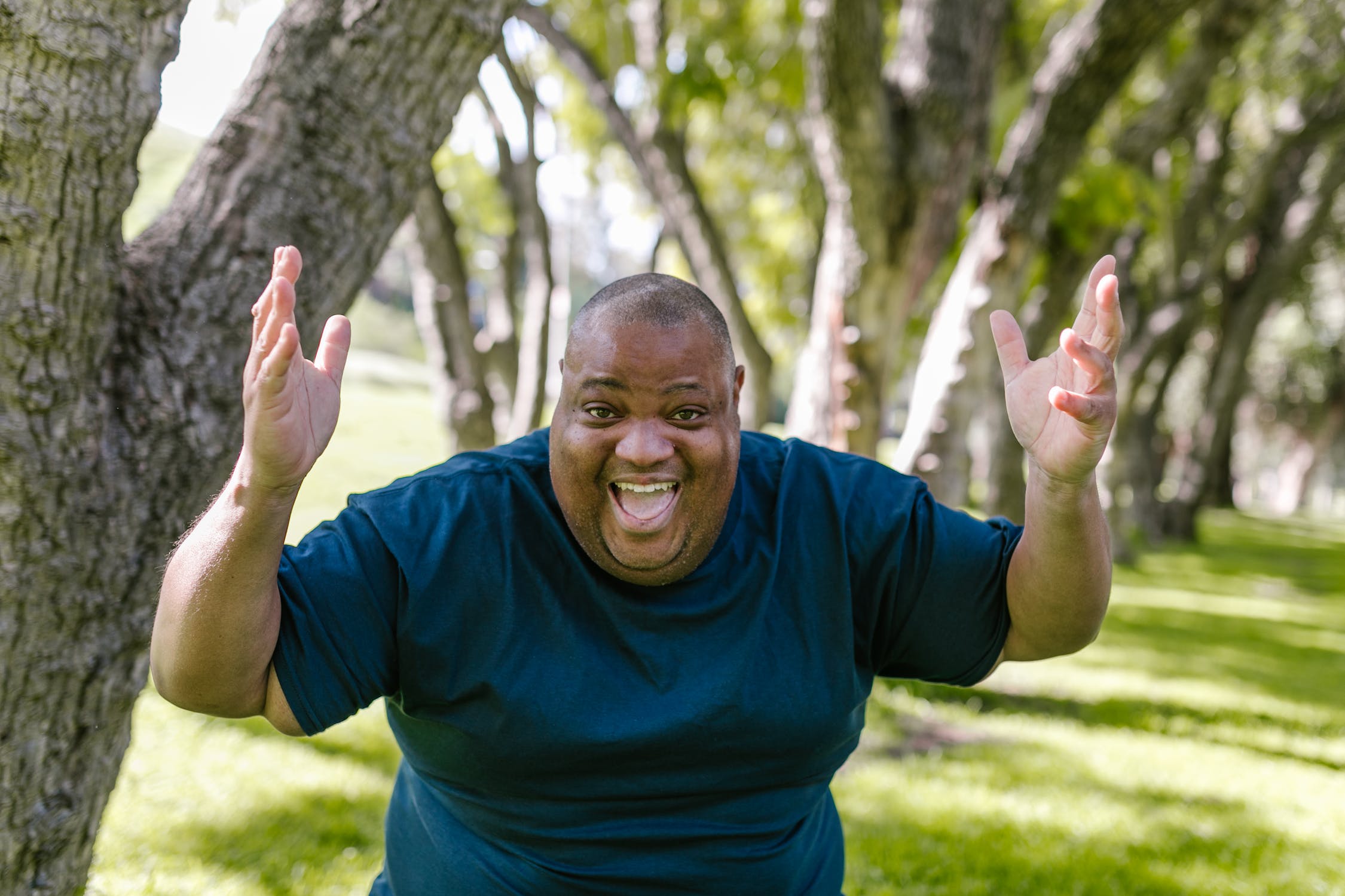 Shows a man proud of his overcoming excuses and working out.